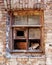 The window frame of a ruined house.