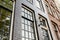 Window front of typical old buildings in Amsterdam, Netherlands