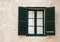 Window with green shutters