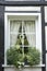 Window of half-timbered house with white flowers