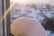 Window of home covered with big snow layer in winter, view from inside, close up. Detail of snowdrift, snow texture.