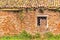 Window with lozenge grate in ruined house