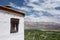 Window of the Matho gompa monastery with beautiful view at the valley and Himalaya mountains in Ladakh, India