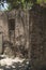 Window of an old house in a wall of adobes and quarry