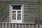 Window of an old residential home in a village in Belarus