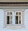 Window of an old russian house decorated with carving, Russia