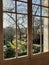 Window overlooking a garden in winter in France.