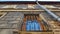 Window Pilaster and Downpipe of an Old Black Building