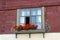 Window with red geraniums