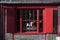 Window with red shutters, decorated with a drawing with a horse in a traditional Christmas style about south bank in London