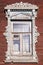 Window Russian house with carved architraves
