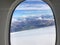 Window shed of aircraft with mountain peak landscape