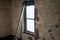 A Window Shining Light Into an Old Room in an Abandoned Building