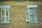 Window shutters on an abandoned brick hotel, PA