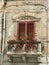 Window with a small baroque style balcony to Palermo in Sicily, Italy.