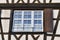 Window of traditional European style half timbered frame house in France