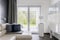 Window in trendy grey living room interior of suburban house