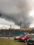 Window view of a huge column of smoke over the city.