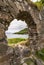 Window in wall of Castle Strome with Loch Carron, Scotland.