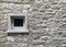 Window on the wall of an old house