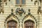 The windows above the entrance to the Sturdza castle in Miclauseni, Romania