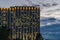 The Windows of the big hotel are shining warmly against the background of the stormy sky