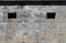 Windows in the Cement Wall of a Military Bunker