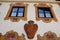 Windows with coat of arms and frescoes in Oberammergau in Germany