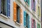 Windows with different color shutters. Geneva, Switzerland