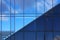 Windows on facade of modern building. Reflection of sky in windows glass