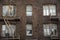 Windows and fire escapes tenement brick apartment building