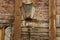 Windows of the old wooden house. wooden wall with vintage lamp