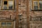 Windows of the old wooden house. wooden wall with windows and vintage lamp