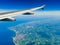 Windows seat view over the French coastline near Calais during a