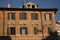 Windows and shutters of ancient Rome, old buildings facade