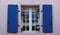 windows with shutters, blue and pink, Belle Ile en Mer, France