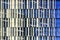 Windows of skyscraper, architecture close up. Glass and concrete. Urban Business District. Modern abstract background