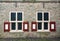 The windows with stained glass in a side wall of a house in Bourtange, a Dutch fortified village in the province of Groningen