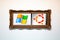 Windows vs Ubuntu abstract concept. Operating system logos in an old painting frame. OS choice, decisions, alternatives, dual boot