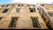 Windows of Weathered Apartment Building in Old Town, Corfu, Greece