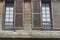 Windows of a wooden tenement house