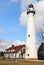 Windpoint Lighthouse portrait with blue sky and clouds.