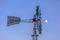 Windpump with multiple blades against sky and moon