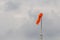 Windsock against blue sky and clouds