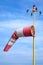 Windsock as an airport equipment over blue sky