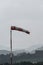 Windsock indicating stormy winds on an airport