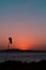 Windsock silhouette in a red sunset on the hills