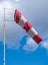Windsock during a strong wind. Windsock shows wind direction and strength. Made of fabric in the form of a cone. It is
