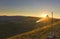 Windsock at sunset in mountains against sun