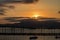 Windsor Bridge Suspension Bridge with the setting sun in the background